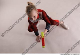 DENISA SITTING POSE WITH GUN